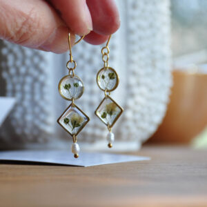 Linked baby's breath dangles with pearls